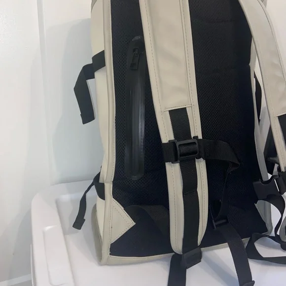 Rains Cream and Black Backpack Roll-Top Design